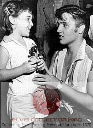 WM 1956 Elvis kneeling to little girl hair just washed with bangs