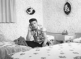 1956 Elvis Presley talking phone n his bed Audubon